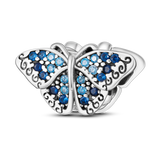 Charm diamants bleus papillon