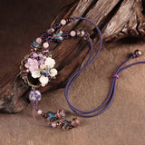 Grand collier créateur violet en fleurs