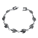 Bracelet fantaisie feuilles noires et diamants