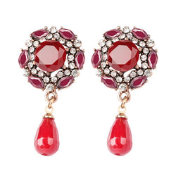 Boucle d'oreille fantaisie perle de rubis motif fleur