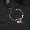 Bracelet fantaisie or chainette à breloque perles et fleur