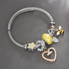 Bracelet fantaisie jonc breloque acier coeur jaune