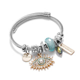 Bracelet fantaisie jonc acier breloque oeil