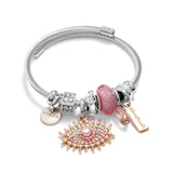 Bracelet fantaisie jonc acier breloque oeil