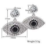 Boucle d'oreille fantaisie argent oeil diamants et pierre noire